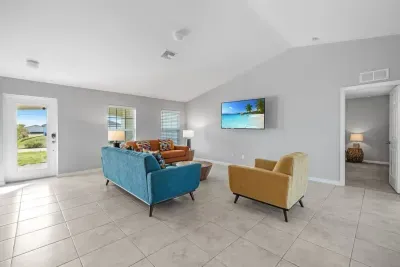Open living room and kitchen with 65 inch flat screen smart TV, stong WiFi and fully-equipped kitchen with all major appliances.