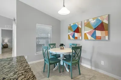 Fully equipped and stocked kitchen with all major appliances, kitchen table with 4 chairs and island with 4 stools.