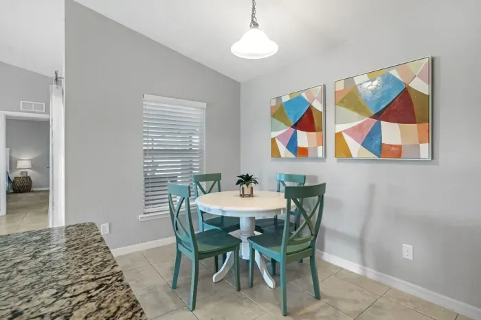 Fully equipped and stocked kitchen with all major appliances, kitchen table with 4 chairs and island with 4 stools.