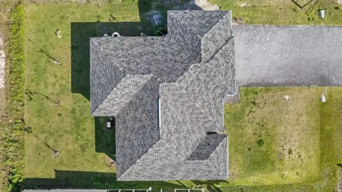 Screened-in Lanai, outdoor dining table, and plenty of outdoor space in both the front and back of out home.