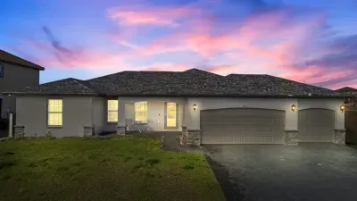 View of our home from the Street. We can park up to 6 vehicles in our 3-car garage and driveway from the Street