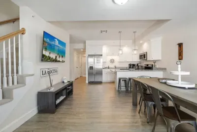 Dining room and kitchen with large smart TV