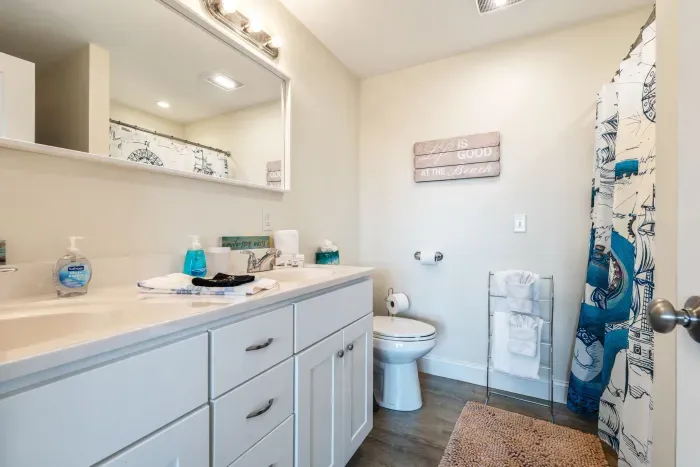 Primary ensuite with washer and dryer and stand up shower