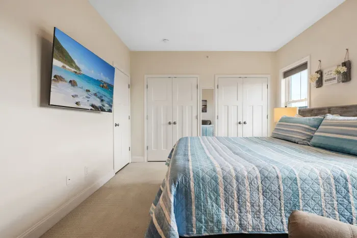 Primary bedroom with linens provided and smart TV