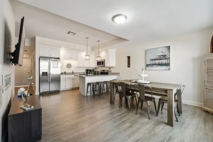 6 person dining table and 4 barstools at peninsula