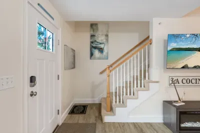 Entryway and stairs located by dining area