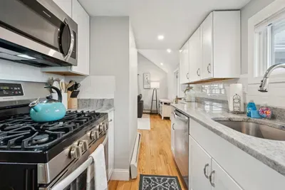 Galley kitchen w/ new appliances and gas stove