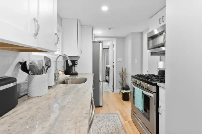 Galley kitchen w/ new appliances and gas stove