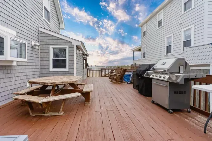 The communal deck space offers direct beach access for all guests. Please note that the BBQ grill on the patio belongs to the other unit. We do provide a Coleman BBQ grill that you are welcome to use. Feel free to use it outside in the common area!