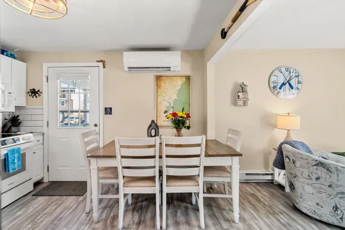 This dining table seats 6 - there is a bench on the other side