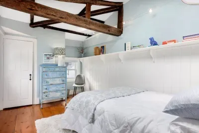 Bedroom #2 with full bed and sky light located on the 3rd floor