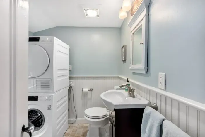 first floor bathroom with walk-in shower and laundry