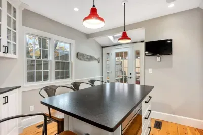 Ground level kitchen with all major appliances and 4-person eat-in island