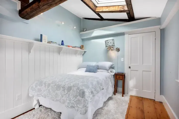 Bedroom #2 with full bed and sky light located on the 3rd floor