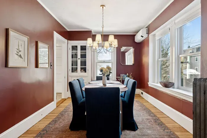 Dining room with seating in comfy chairs for 6