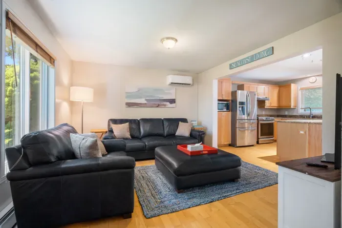 Living room with comfortable couch set up and smart TV