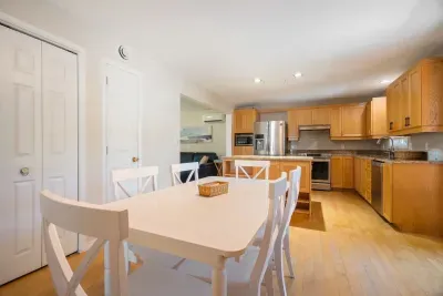 Fully equipped kitchen with updated appliances and 6-person dining table