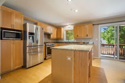 Fully equipped kitchen with updated appliances and 6-person dining table