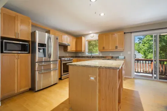 Fully equipped kitchen with updated appliances and 6-person dining table