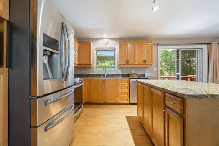 Fully equipped kitchen with updated appliances and 6-person dining table