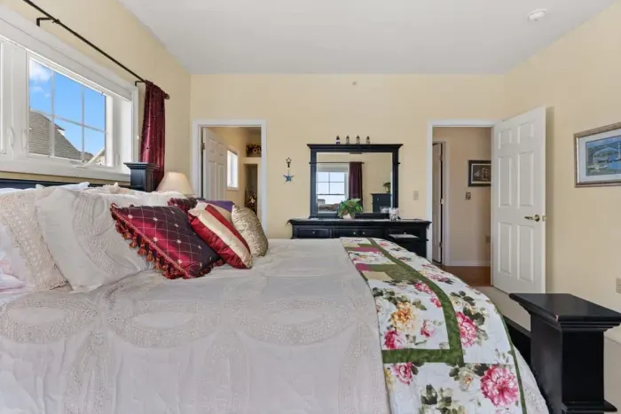 Primary bedroom with a queen-size bed and ensruite bathroom