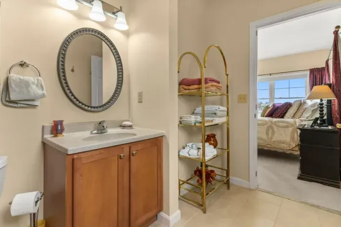 Ensuite bathroom, off the primary bedroom, with jetted shower tub.