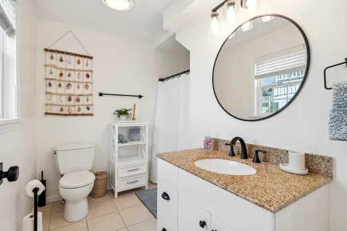 Full bathroom with standing shower located on ground level. Clean towels provided.