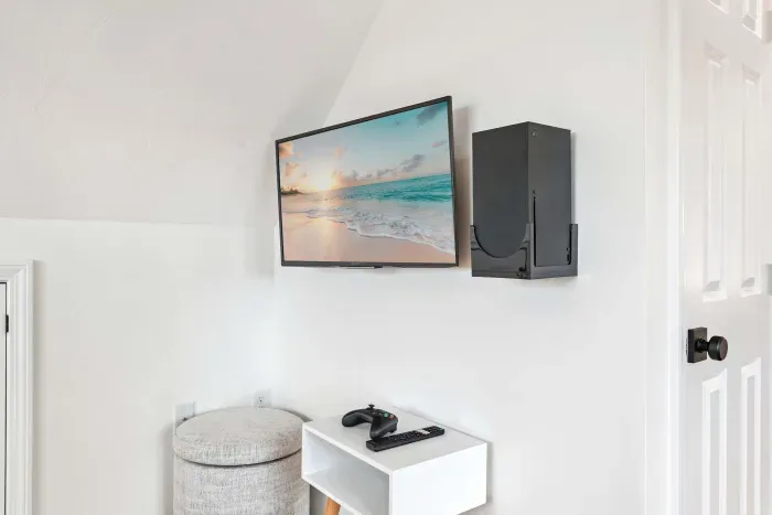 Bedroom #2 with a queen bed and sleeper sofa located on the second floor with a smart TV and minisplit heating and cooling. Clean linens and towels provided.