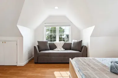 Bedroom #2 with a queen bed and sleeper sofa located on the second floor with a smart TV and minisplit heating and cooling. Clean linens and towels provided.