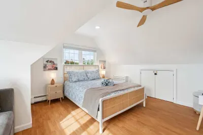 Bedroom #2 with a queen bed and sleeper sofa located on the second floor with a smart TV and minisplit heating and cooling. Clean linens and towels provided.