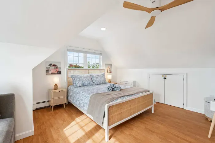 Bedroom #2 with a queen bed and sleeper sofa located on the second floor with a smart TV and minisplit heating and cooling. Clean linens and towels provided.