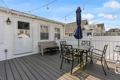 Private back deck withgas grill and views of the harbor