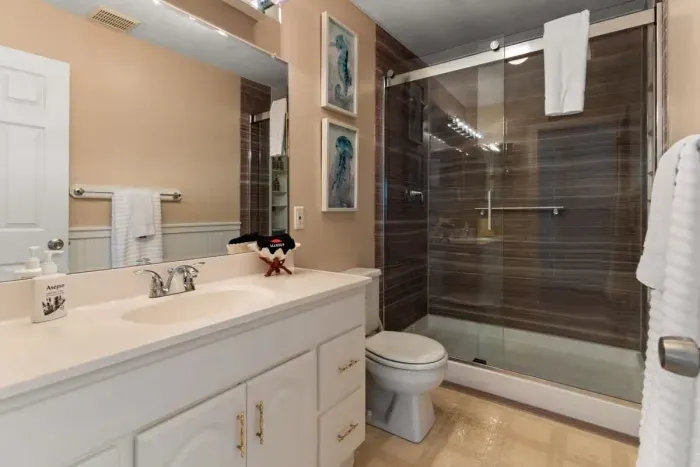 full bathroom on ground level with tiled shower