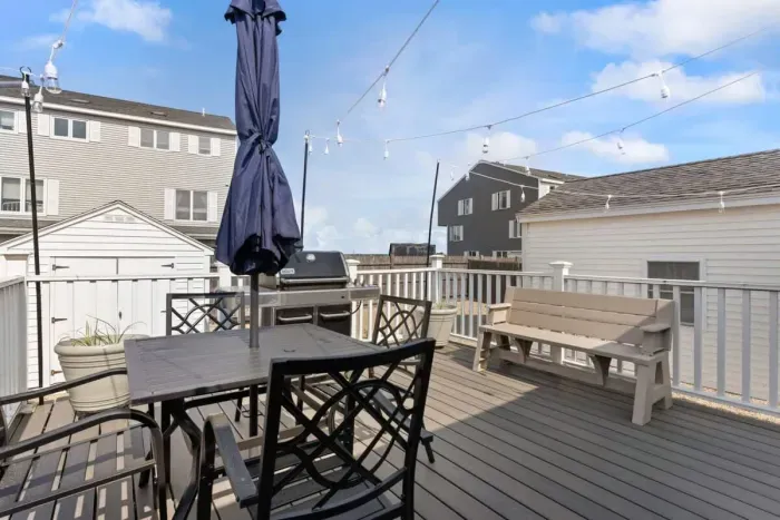Private back deck withgas grill and views of the harbor