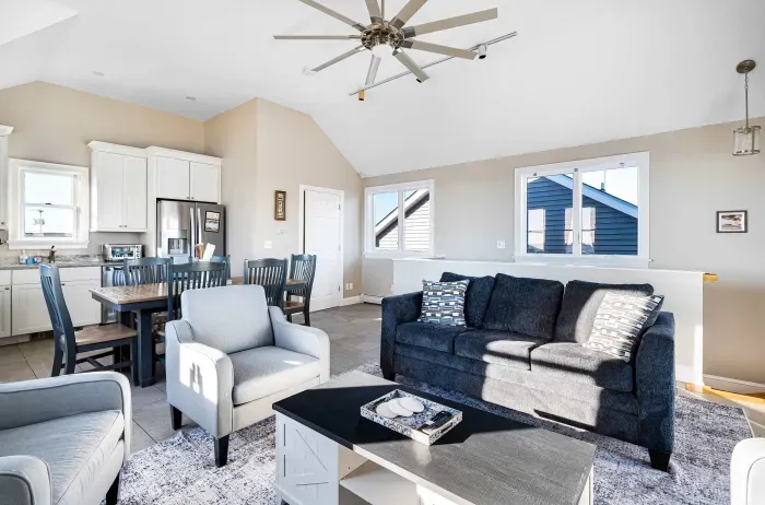 The top floor! This space features seating for 7, a dining table for 6 with additional foldable chairs, and updated kitchen with dishwasher