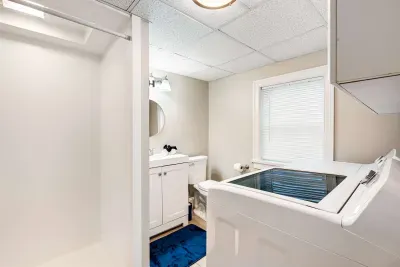 Large stand up shower on the lower level, this bathroom also has the washer and dryer for guest use.  Clean towels provided.