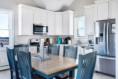 Fully equipped kitchen with basic cooking needs, utensils and plates.  More space available at table with removable leaf and extra folding chairs.