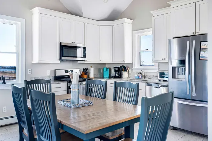 Fully equipped kitchen with basic cooking needs, utensils and plates.  More space available at table with removable leaf and extra folding chairs.