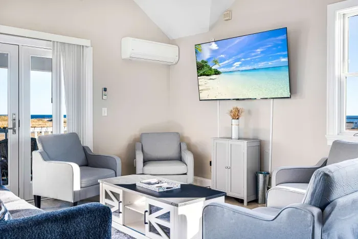 Main floor living space with large smart TV for all your streaming needs.  