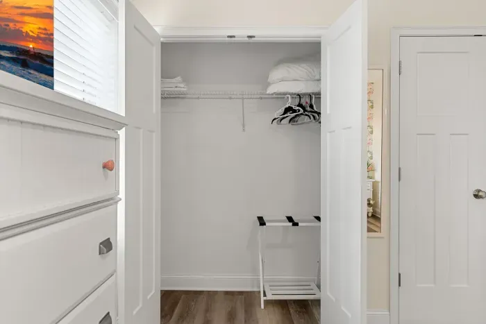 Primary bedroom with king bed, two large closets, smart TV and en-suite bathroom.