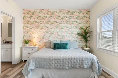 Primary bedroom with king bed, two large closets, smart TV and en-suite bathroom.