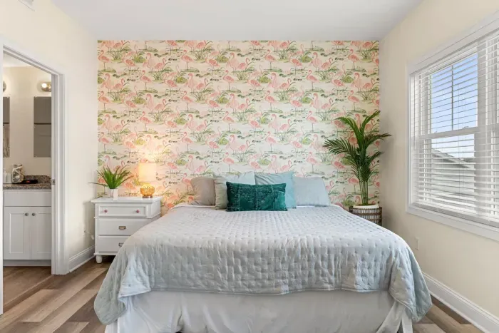 Primary bedroom with king bed, two large closets, smart TV and en-suite bathroom.