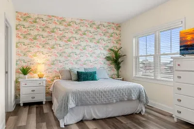 Primary bedroom with king bed, two large closets, smart TV and en-suite bathroom.