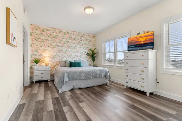 Primary bedroom with king bed, two large closets, smart TV and en-suite bathroom.