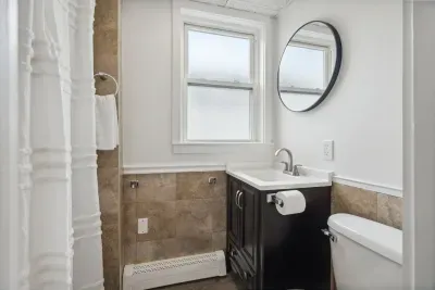 Full bathroom with a standing shower
