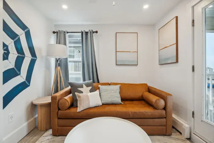 Cozy living space featuring a sleeper sofa and cable TV