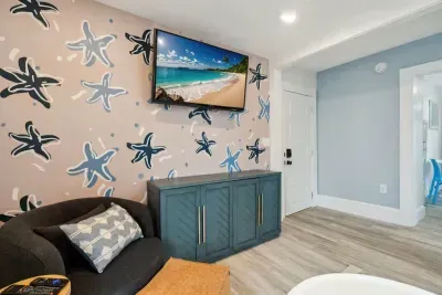 Cozy living space featuring a sleeper sofa and cable TV