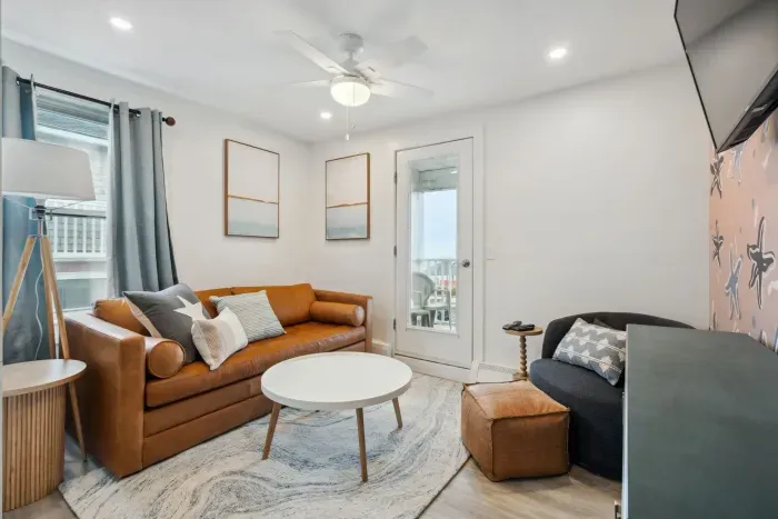 Cozy living space featuring a sleeper sofa and cable TV