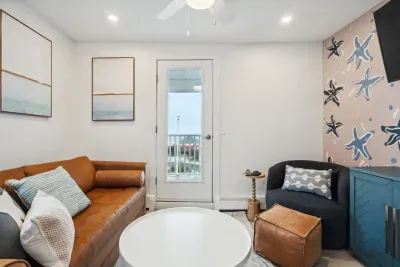 Cozy living space featuring a sleeper sofa and cable TV