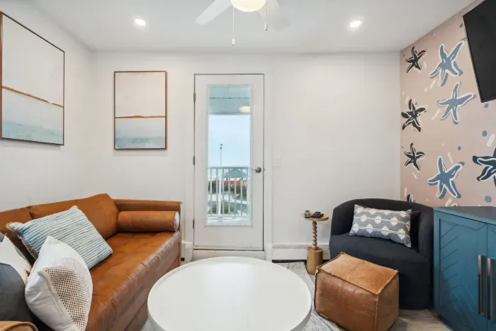 Cozy living space featuring a sleeper sofa and cable TV